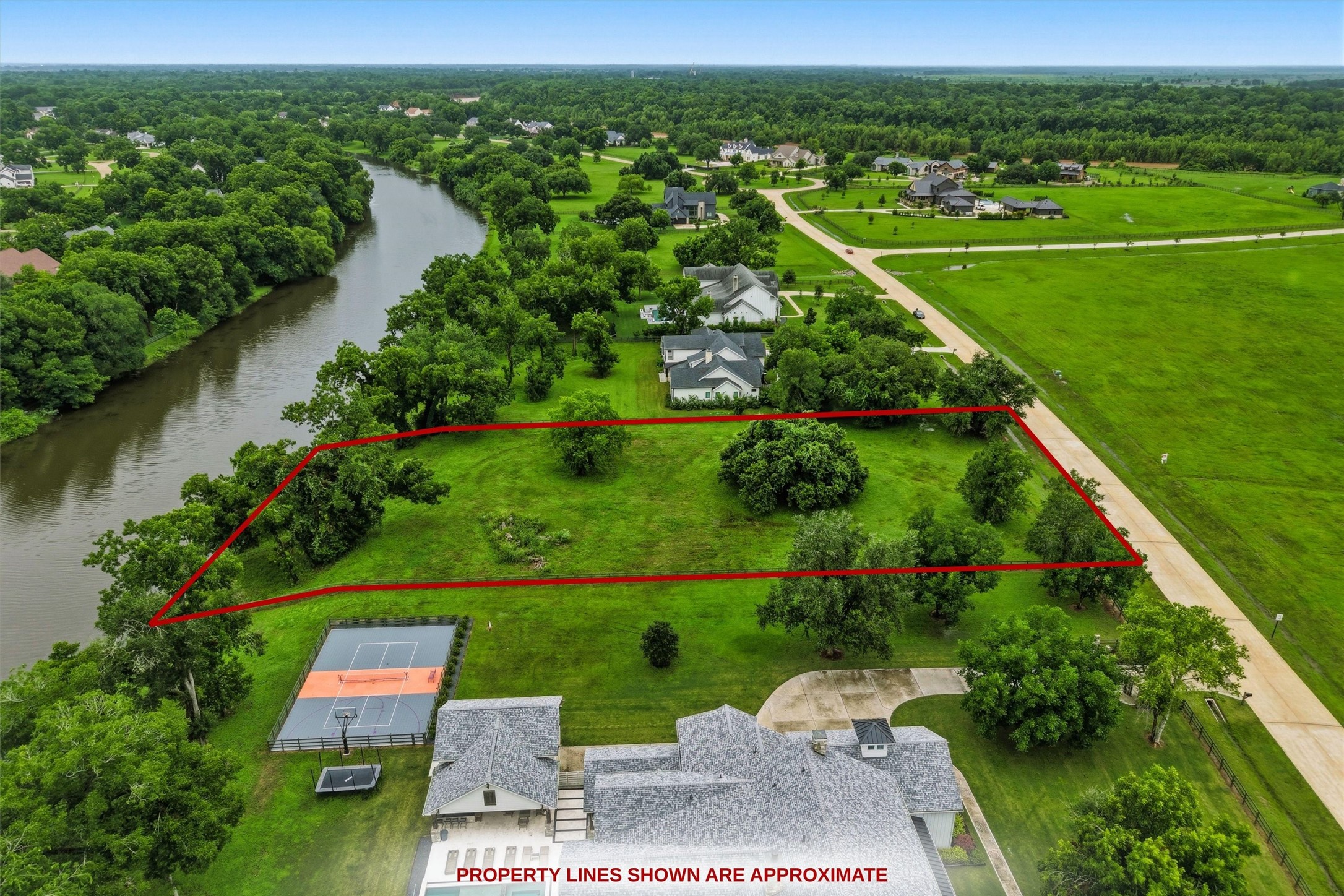0 Riverlake Road Fulshear, TX 77441 - Photo 6 of 47 Perfectly positioned along the river, this extraordinary homesite offers breathtaking water views and abundant privacy. The spectacular setting provides the ideal canvas for designing a custom estate that seamlessly blends luxury living with nature.