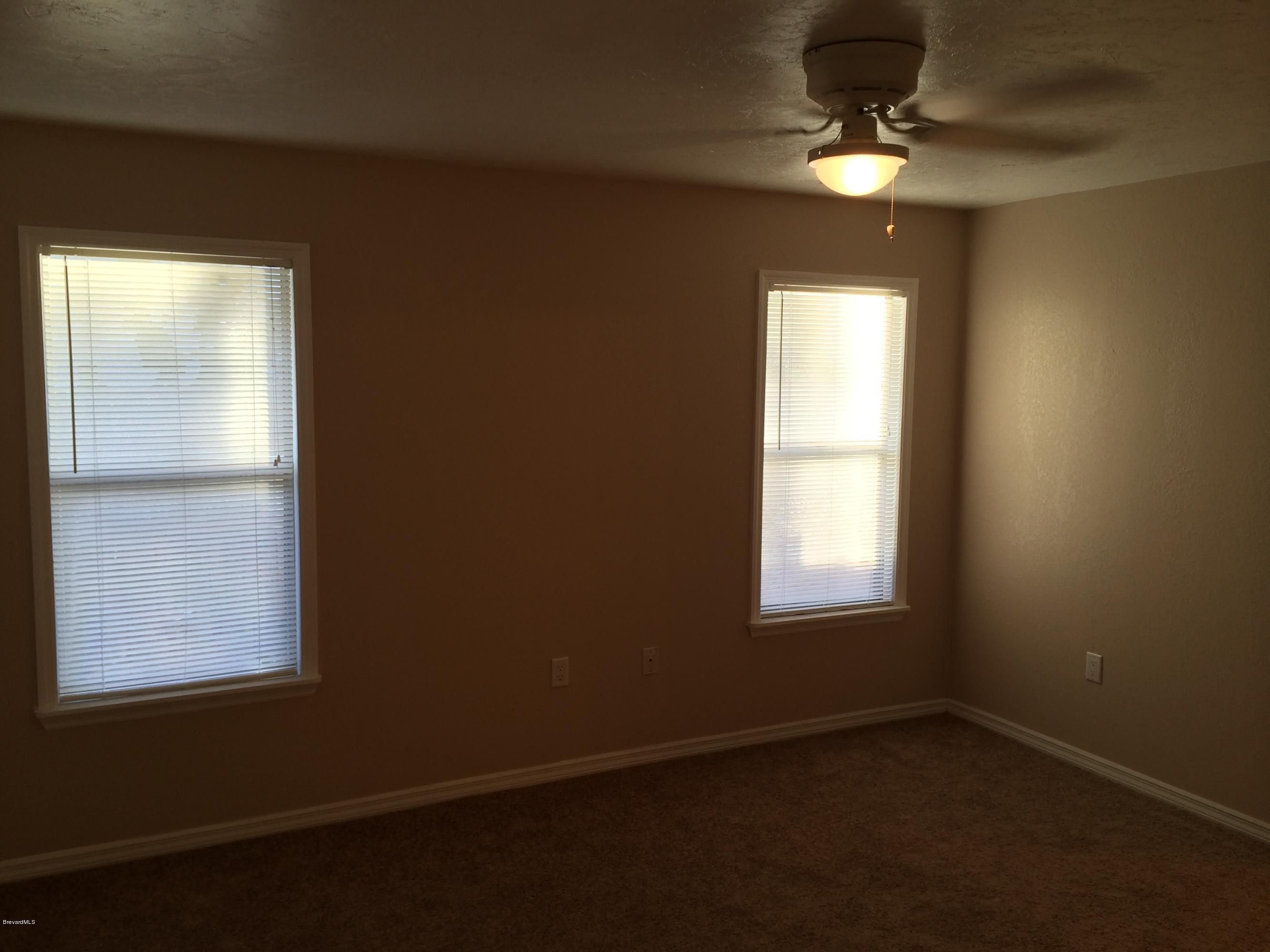 6151 Corning Road Cocoa, FL 32927 - Photo 3 of 13 an empty room with a window