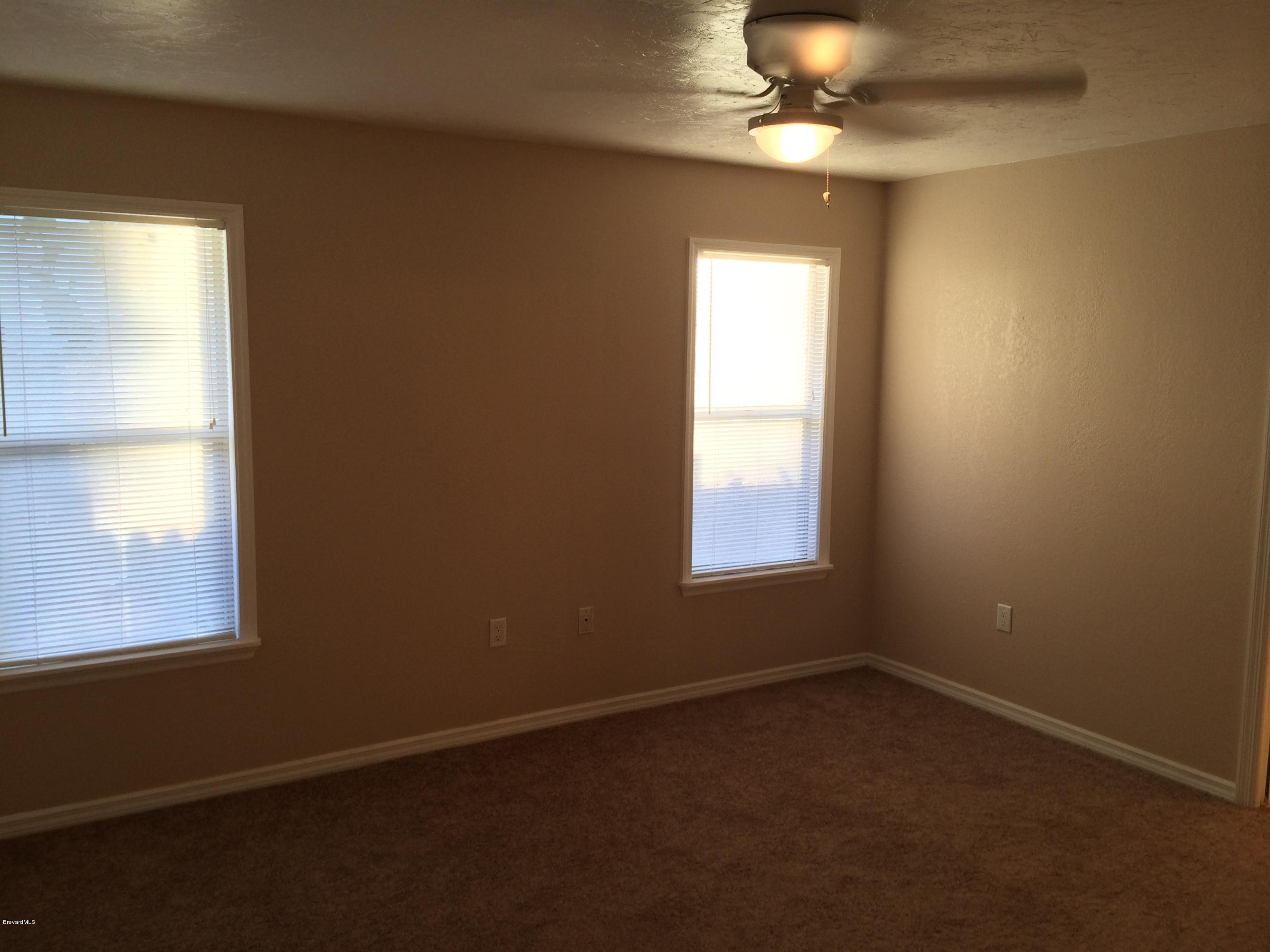 6151 Corning Road Cocoa, FL 32927 - Photo 4 of 13 an empty room with a window