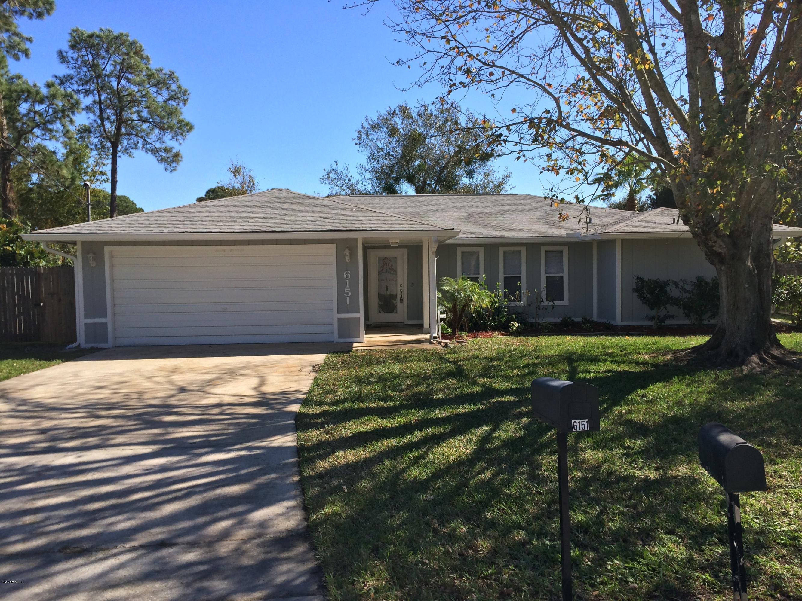 6151 Corning Road Cocoa, FL 32927 - Photo 5 of 13 front view of a house with a yard