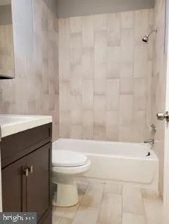 a bathroom with a sink a toilet and a bathtub