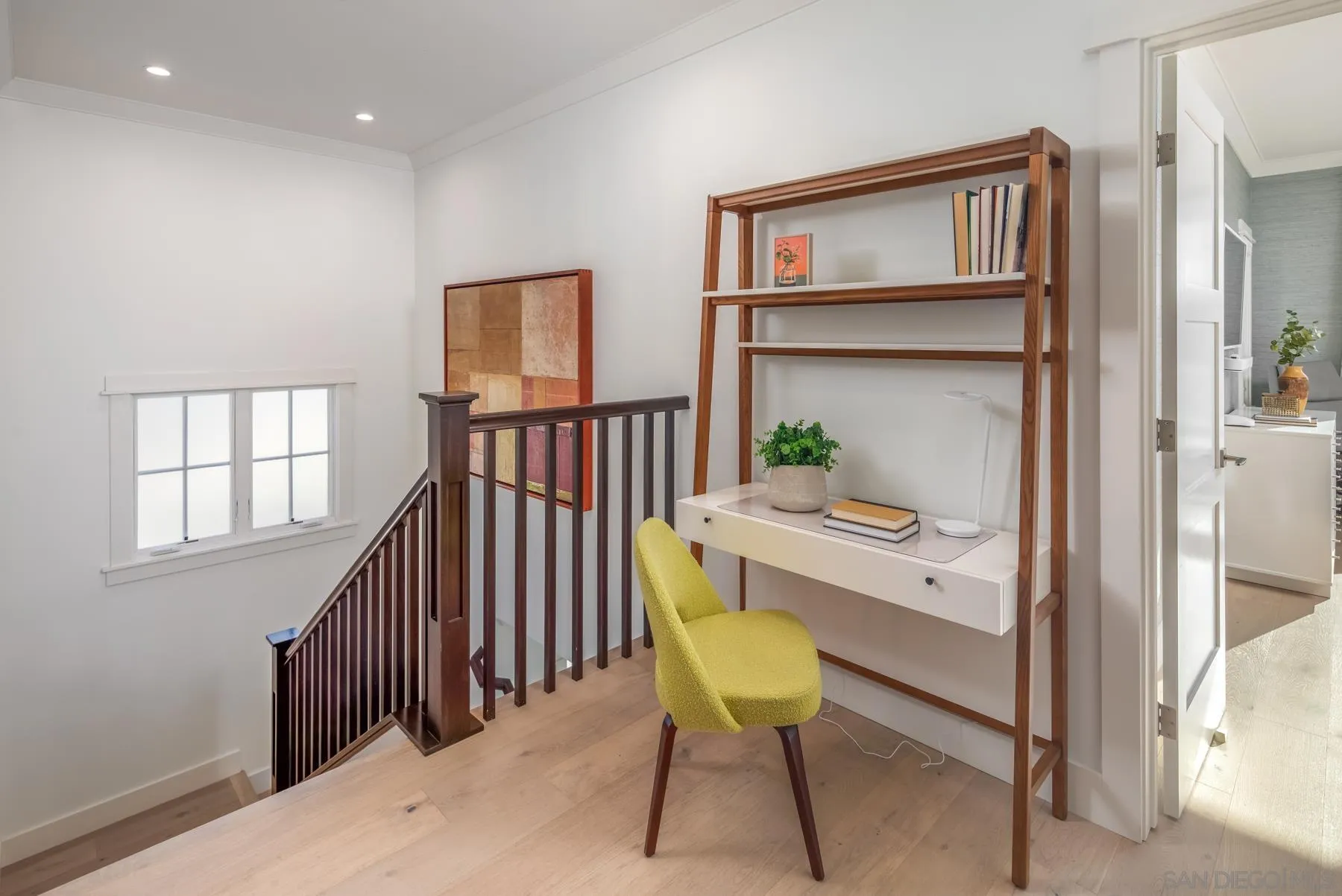 237 La Mesa Avenue Encinitas, CA 92024 - Photo 16 of 40 a view of a hallway to room with wooden floor and windows
