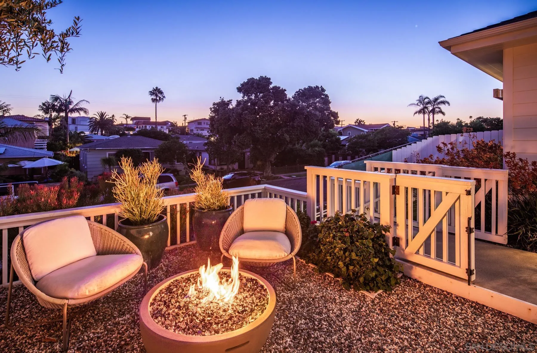 237 La Mesa Avenue Encinitas, CA 92024 - Photo 26 of 40 a backyard of a house with table and chairs