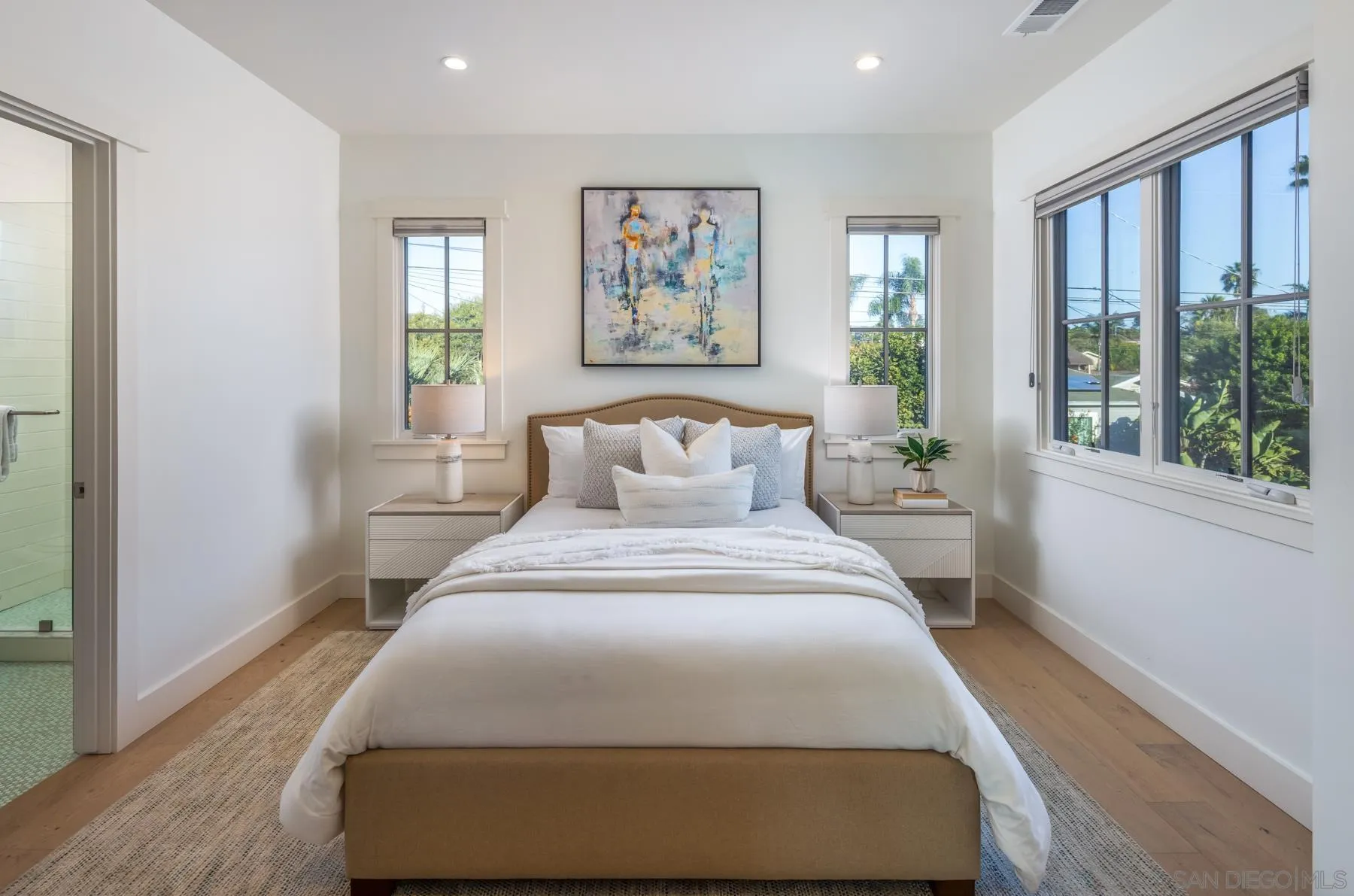 237 La Mesa Avenue Encinitas, CA 92024 - Photo 27 of 40 a bedroom with a large bed and a window