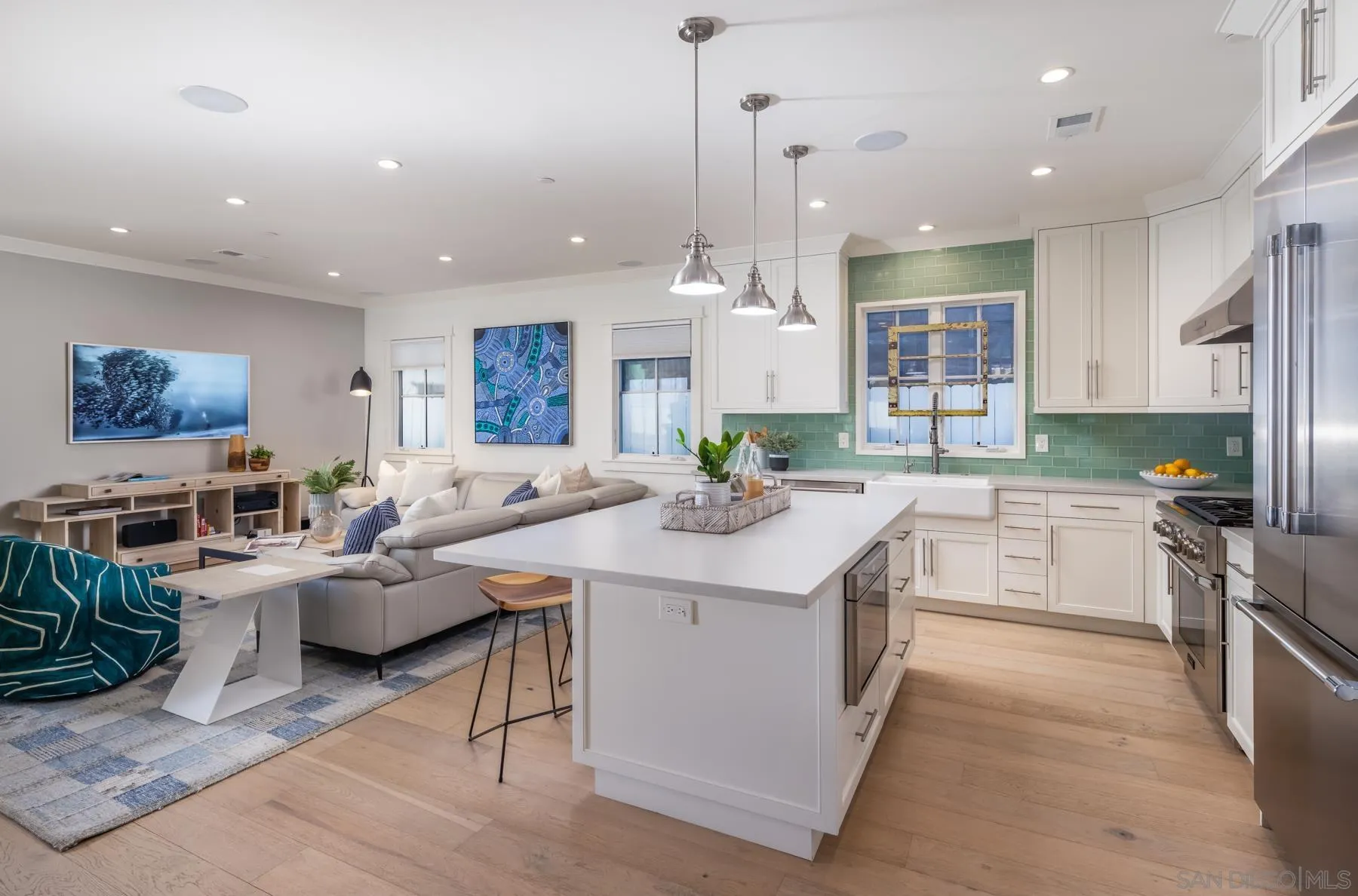 237 La Mesa Avenue Encinitas, CA 92024 - Photo 7 of 40 a large kitchen with lots of counter top space a sink appliances and cabinets