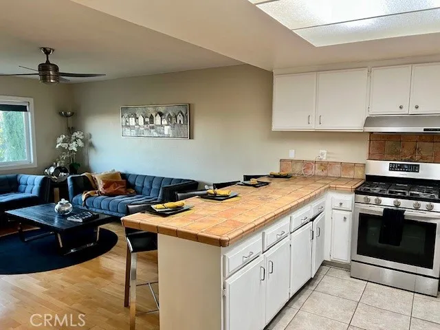 a kitchen that has a cabinets and a stove
