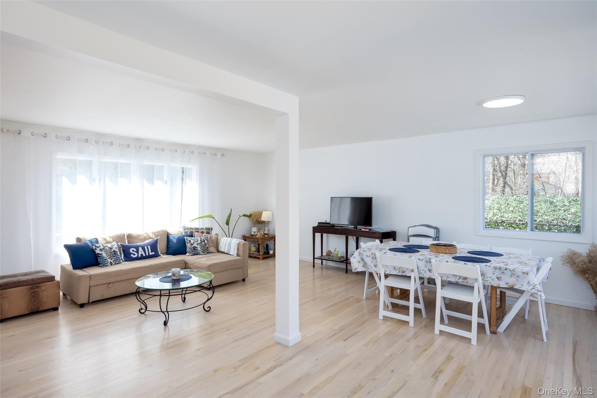371 South River Road Calverton, NY 11933 - Photo 11 of 43 Living area featuring wood finished floors and baseboards