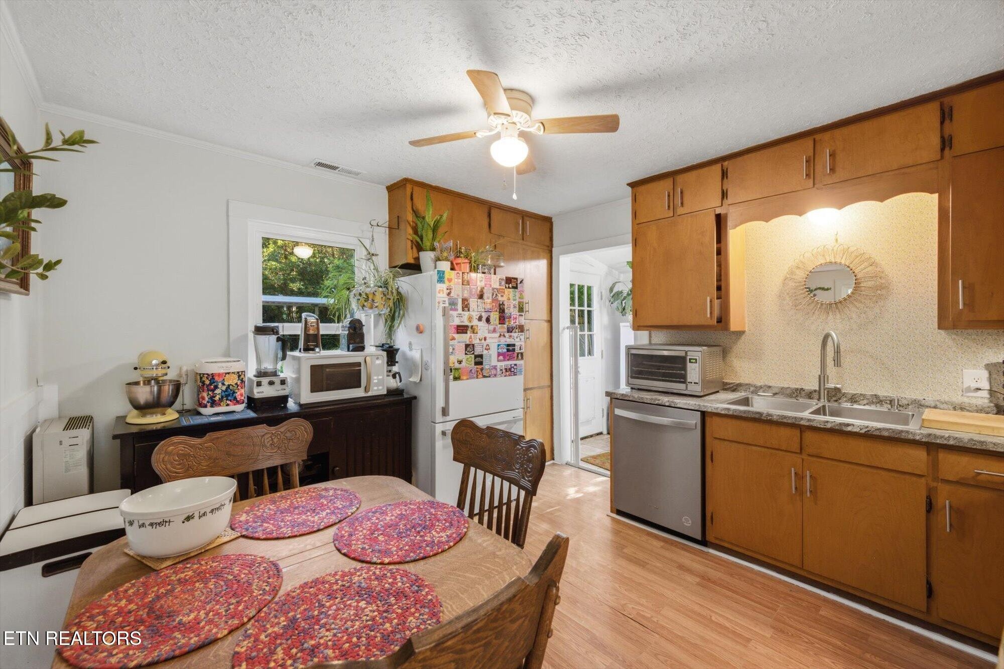 159 Mill Street Delano, TN 37325 - Photo 8 of 22 a kitchen with a sink stove and refrigerator