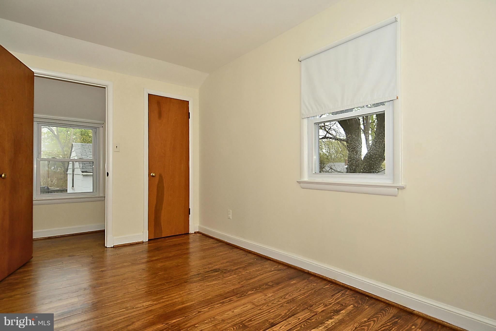 2507 Sheraton Street Silver Spring, MD 20906 - Photo 15 of 23 a view of an empty room with wooden floor and a window