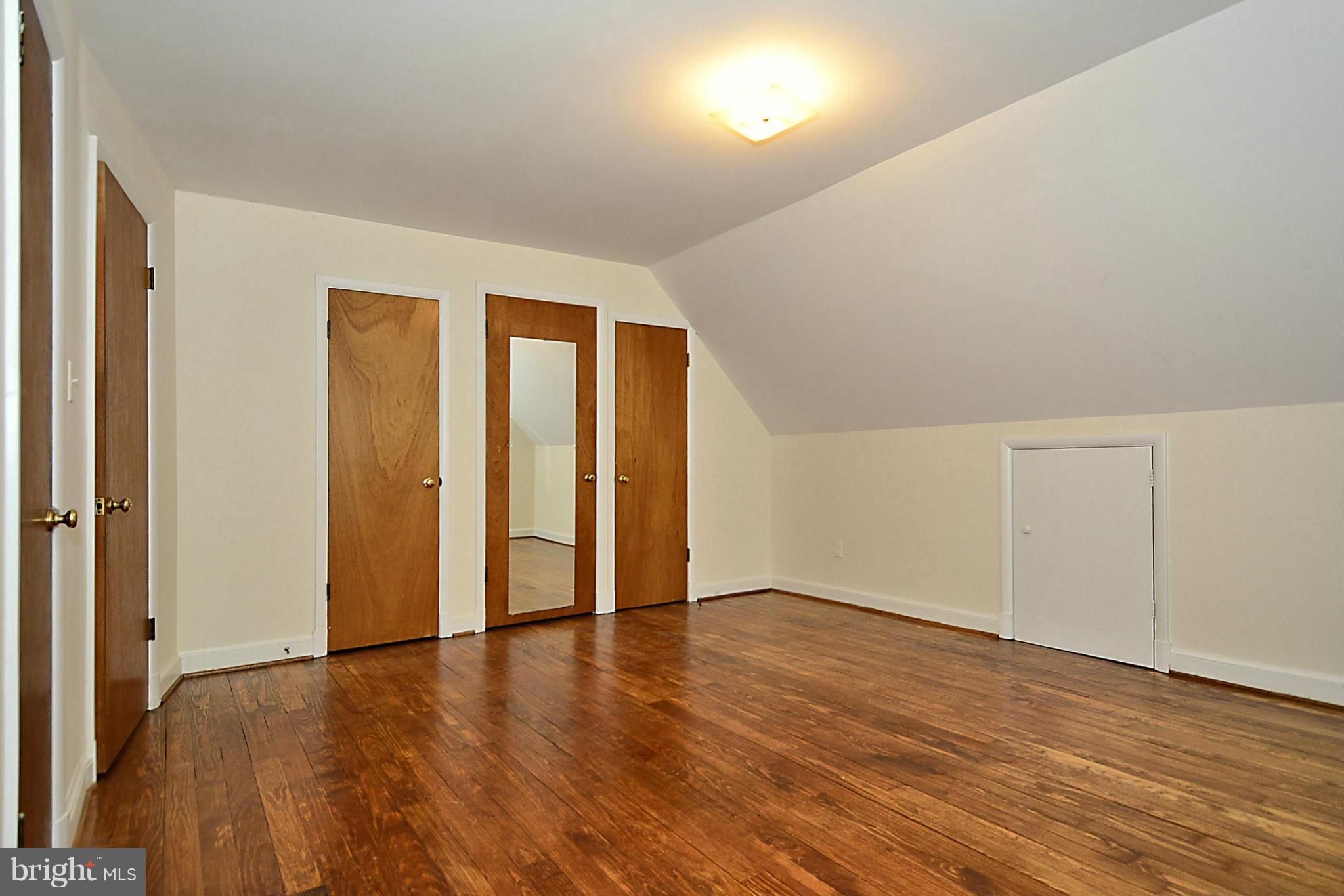 2507 Sheraton Street Silver Spring, MD 20906 - Photo 17 of 23 a view of an empty room with wooden floor and closet