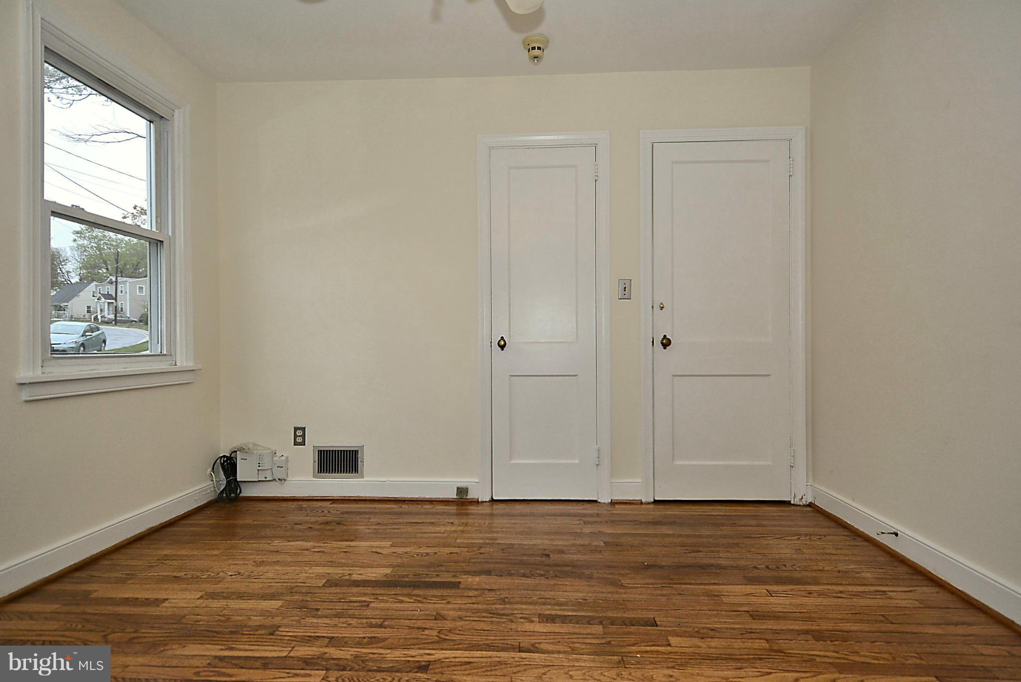 2507 Sheraton Street Silver Spring, MD 20906 - Photo 9 of 23 a view of a room with wooden floor and window