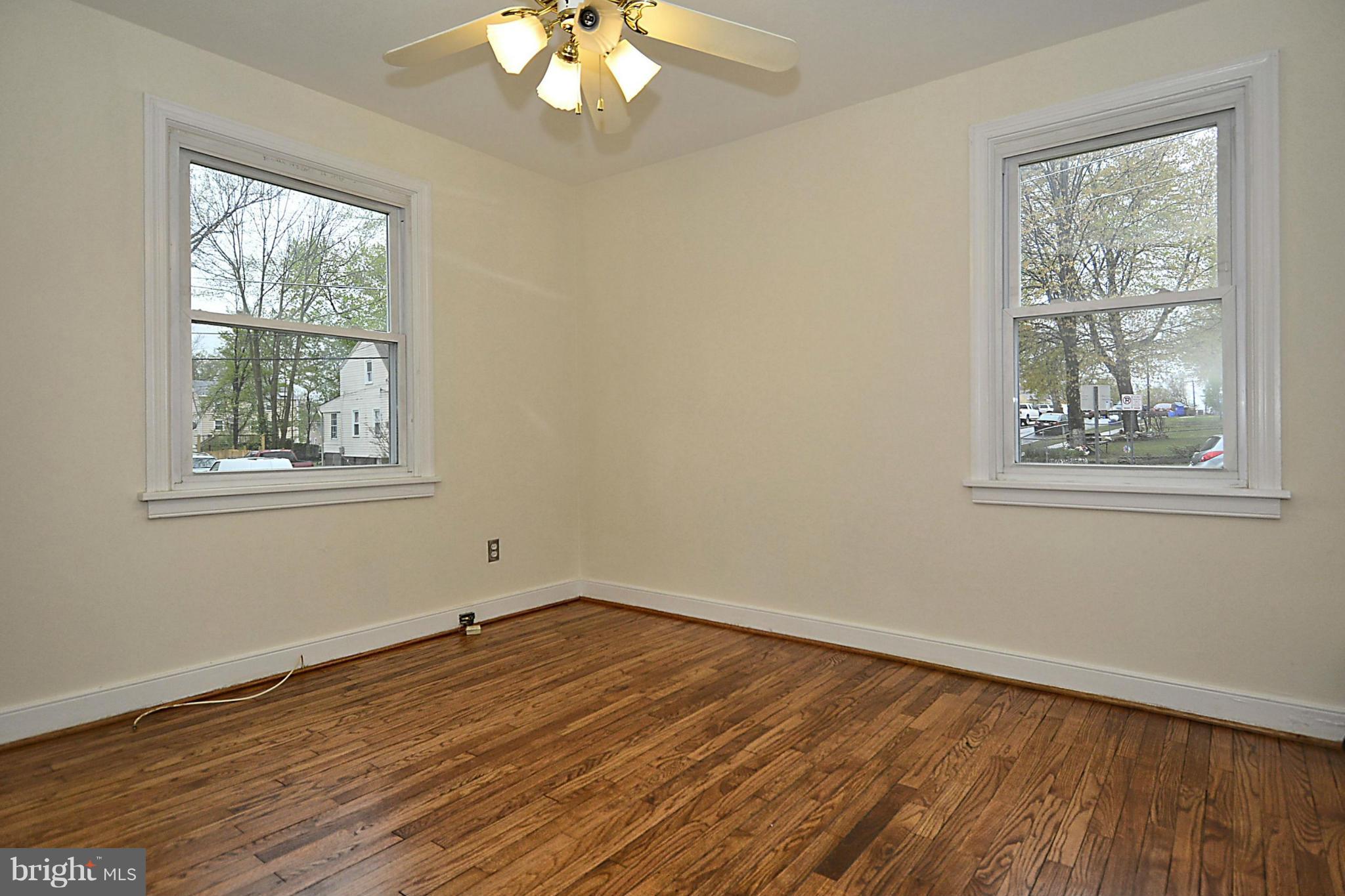 2507 Sheraton Street Silver Spring, MD 20906 - Photo 10 of 23 a view of an empty room with wooden floor and a window