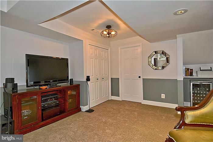 2617 South Arlington Ridge Road Arlington, VA 22202 - Photo 22 of 30 a living room with furniture and a flat screen tv