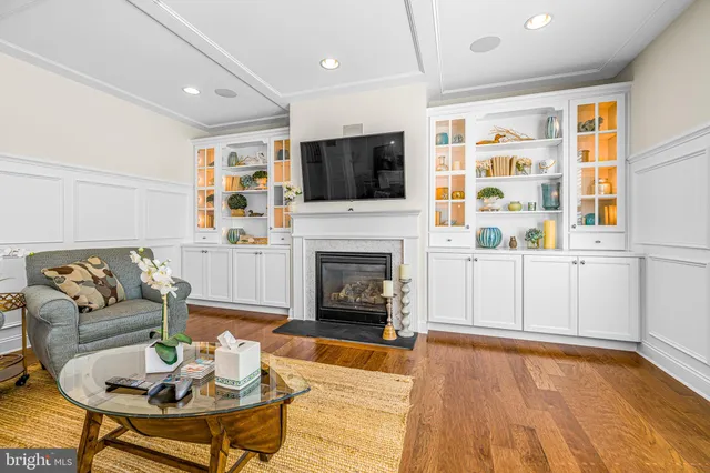 a living room with furniture and kitchen view