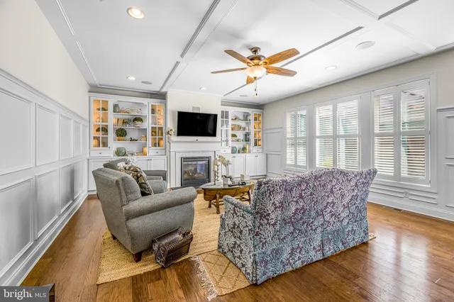 a bathroom with a toilet a sink and a window