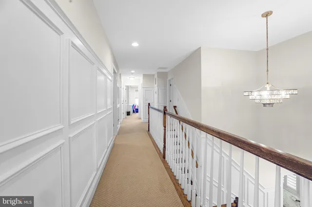a spacious bathroom with a mirror and a shower