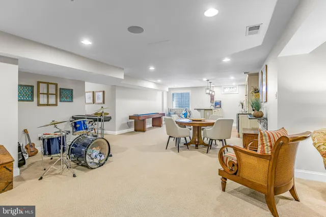 a view of a patio with a table and chairs and potted plants