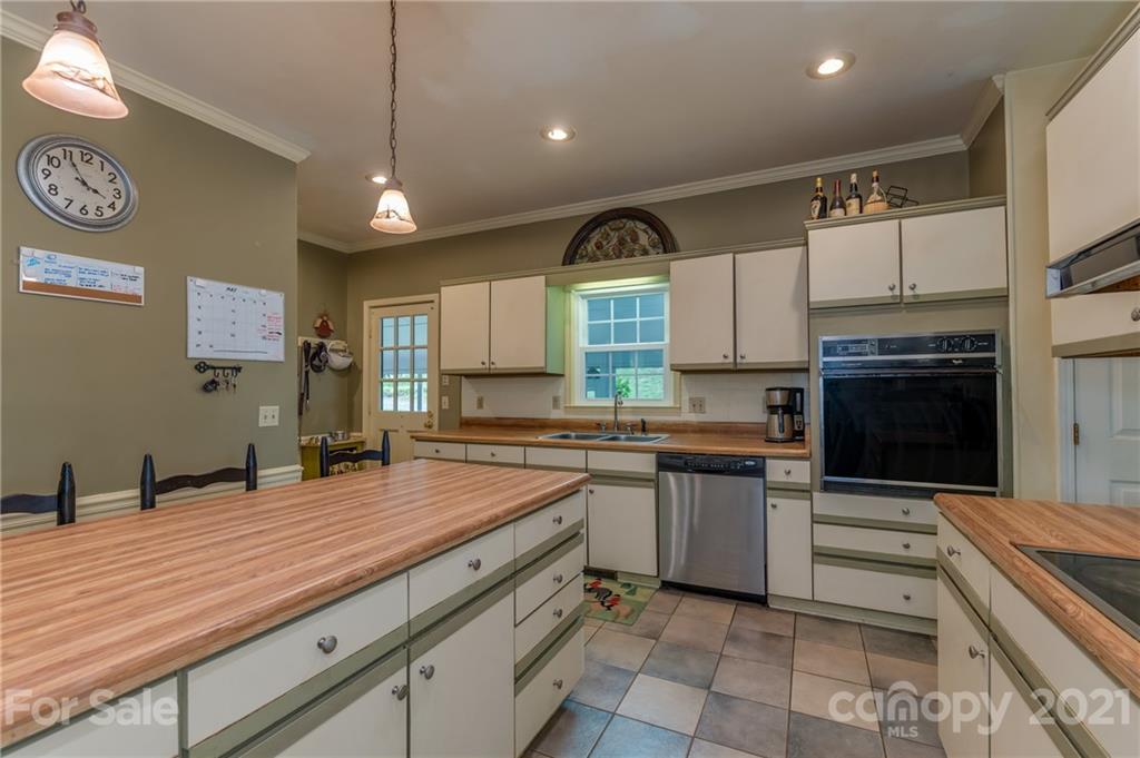 4733 Hunting Country Road Tryon, NC 28782 - Photo 17 of 48 a kitchen with a sink cabinets and window