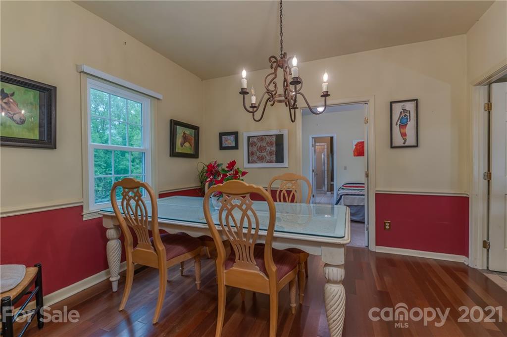 4733 Hunting Country Road Tryon, NC 28782 - Photo 18 of 48 a view of a dining room with furniture window and wooden floor
