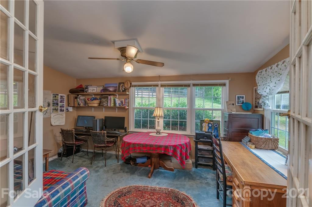 4733 Hunting Country Road Tryon, NC 28782 - Photo 26 of 48 a bedroom with furniture and a large window