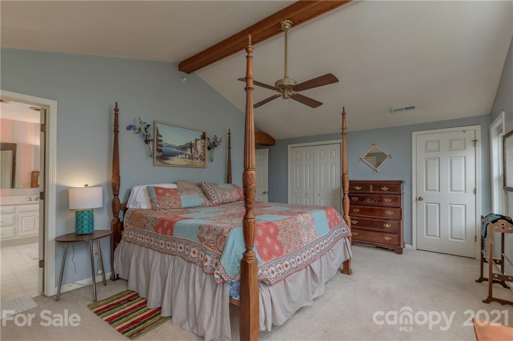 4733 Hunting Country Road Tryon, NC 28782 - Photo 29 of 48 a bedroom with a bed next to a window