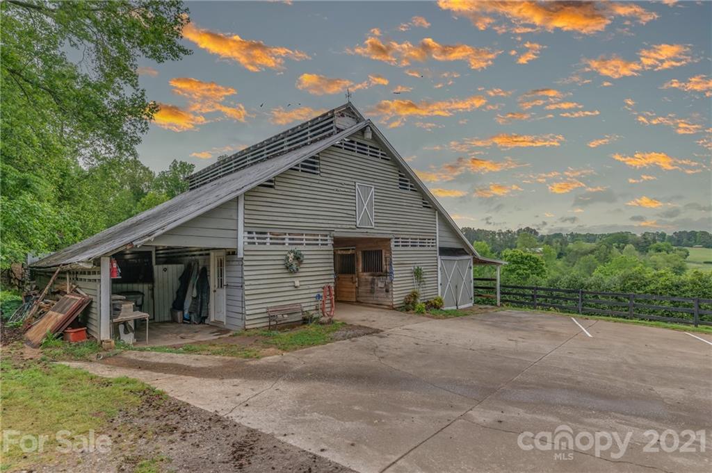 4733 Hunting Country Road Tryon, NC 28782 - Photo 4 of 48 a view of a house with backyard and sitting area