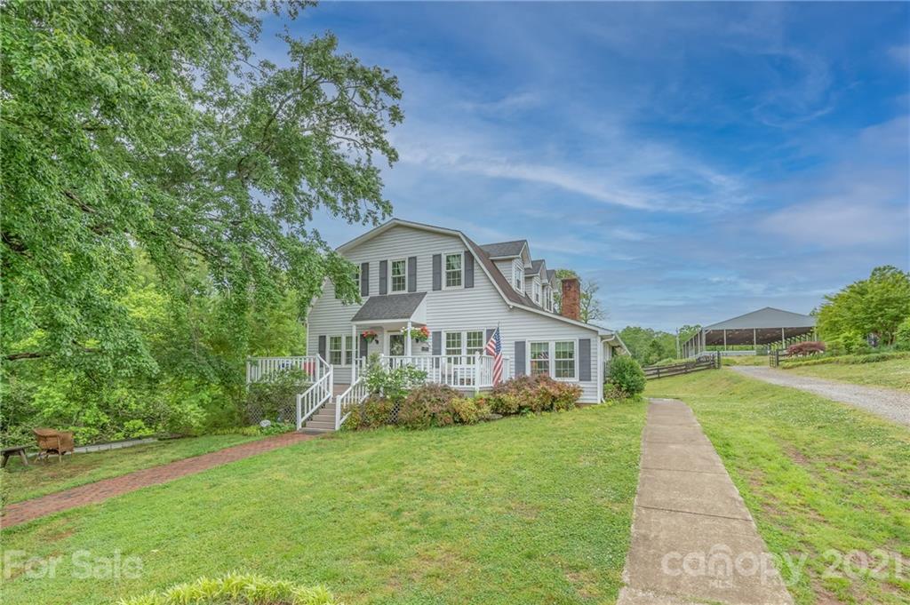 4733 Hunting Country Road Tryon, NC 28782 - Photo 38 of 48 a front view of a house with a garden