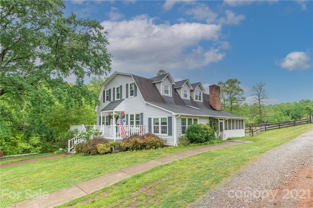 4733 Hunting Country Road Tryon, NC 28782 - Photo 39 of 48 a front view of a house with garden