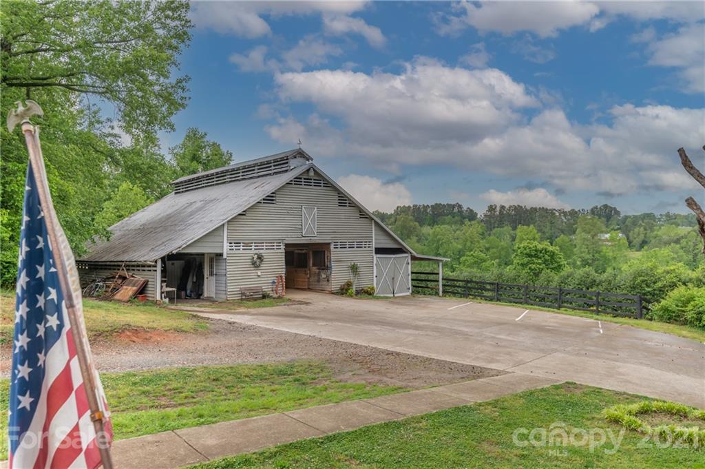 4733 Hunting Country Road Tryon, NC 28782 - Photo 41 of 48 a front view of house with yard and green space
