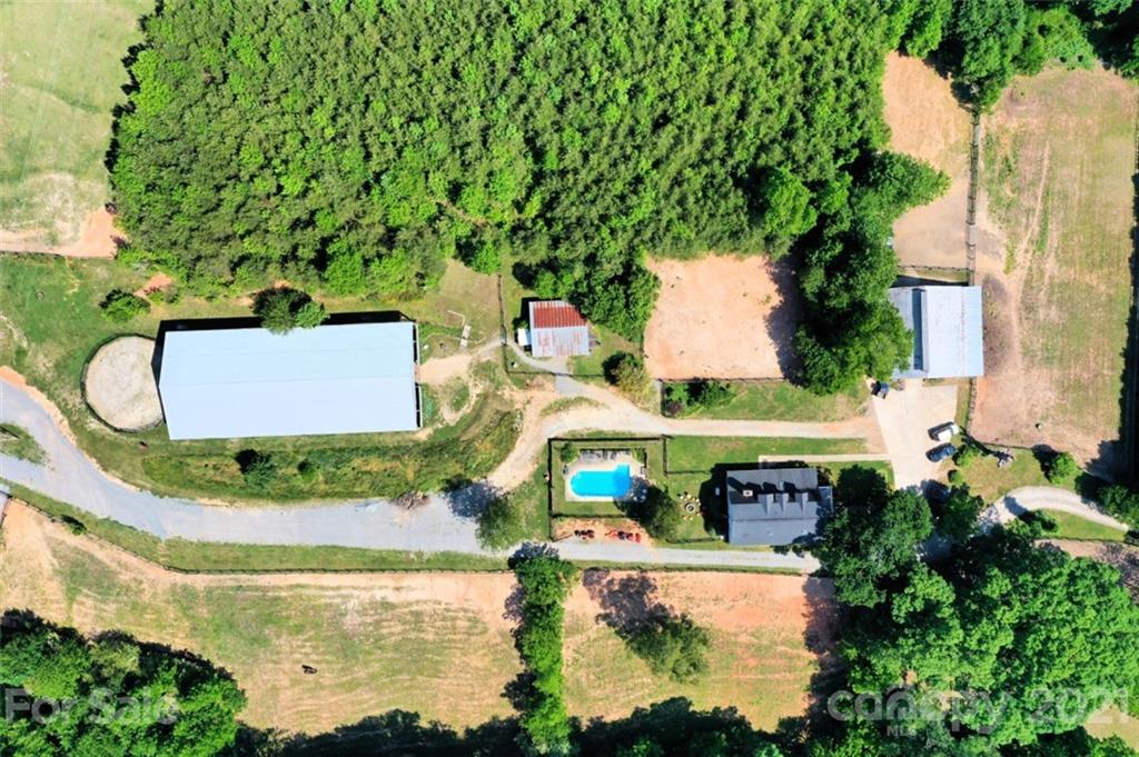4733 Hunting Country Road Tryon, NC 28782 - Photo 46 of 48 an aerial view of a house with outdoor space and trees all around