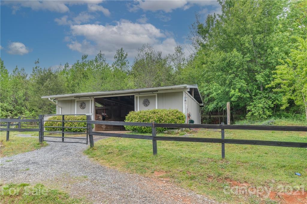 4733 Hunting Country Road Tryon, NC 28782 - Photo 10 of 48 a house view with a garden space