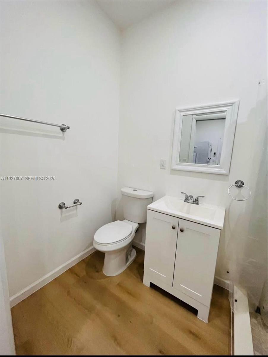 12950 Southwest 229th Lane, Unit 2 Miami, FL 33170 - Photo 4 of 6 a bathroom with a toilet sink and shower