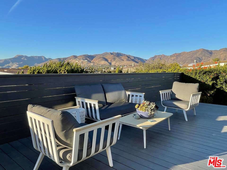 29500 Heathercliff Road, Unit 260 Malibu, CA 90265 - Photo 17 of 23 a view of a chairs and table on the terrace