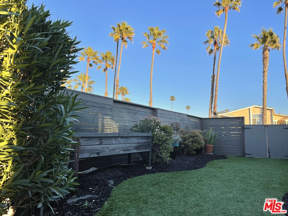 29500 Heathercliff Road, Unit 260 Malibu, CA 90265 - Photo 19 of 23 a view of a backyard with plants and a potted plant