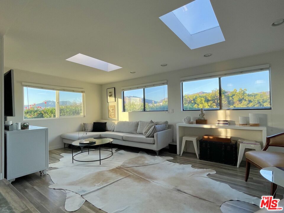 29500 Heathercliff Road, Unit 260 Malibu, CA 90265 - Photo 4 of 23 a living room with furniture and a large window