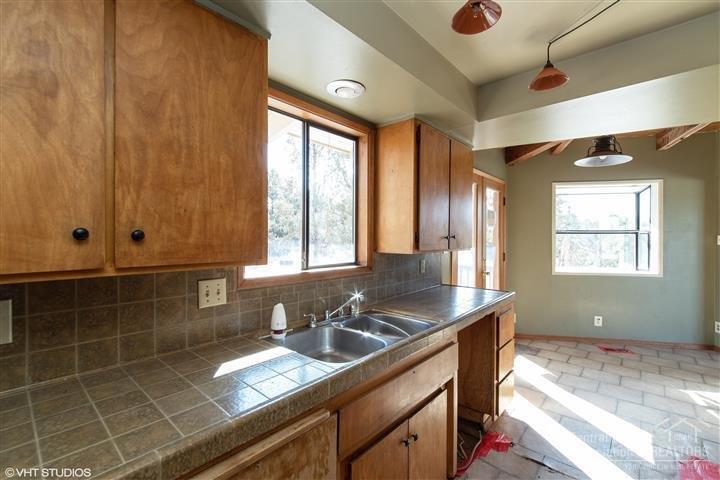 62260 Deer Trail Road Bend, OR 97701 - Photo 10 of 24 Kitchen is open to the dining area.