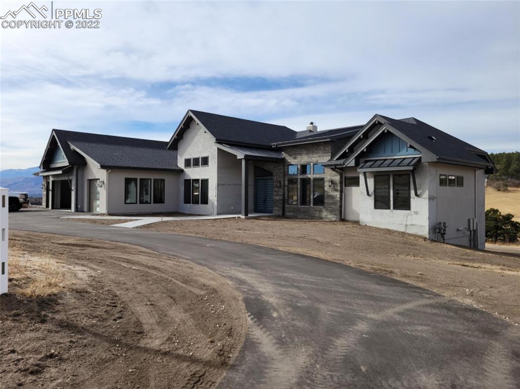 14750 Raton Road Colorado Springs, CO 80921 - Photo 1 of 1 a front view of a house with a yard