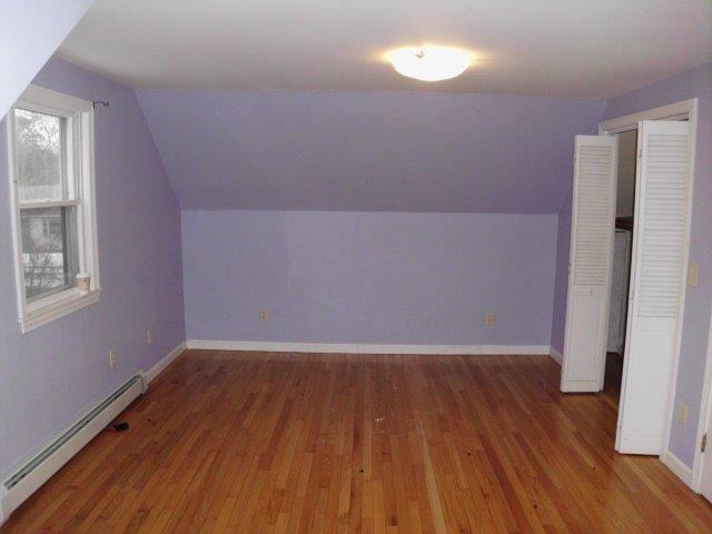 7 Coach Light Road Centerville, MA 02632 - Photo 11 of 22 an empty room with wooden floor and windows