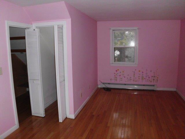 7 Coach Light Road Centerville, MA 02632 - Photo 14 of 22 a view of an empty room with wooden floor and a window