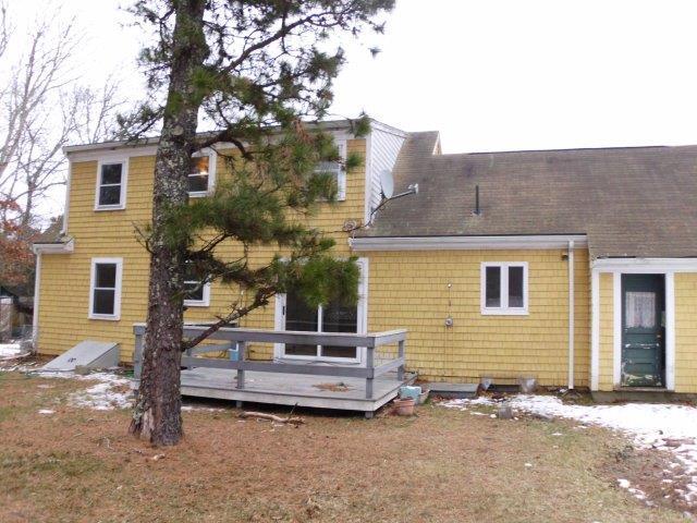 7 Coach Light Road Centerville, MA 02632 - Photo 19 of 22 a view of a house with a yard and fence