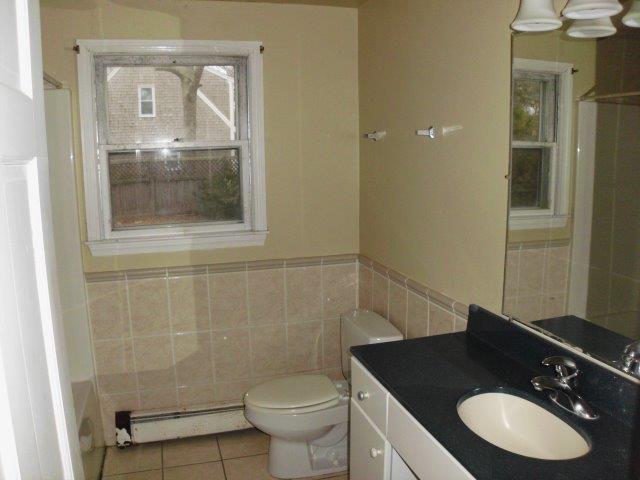 7 Coach Light Road Centerville, MA 02632 - Photo 5 of 22 a bathroom with a granite countertop sink toilet and mirror