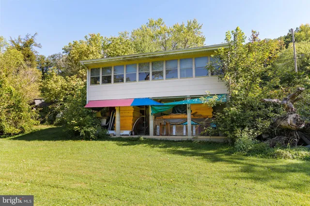 a front view of house with garden