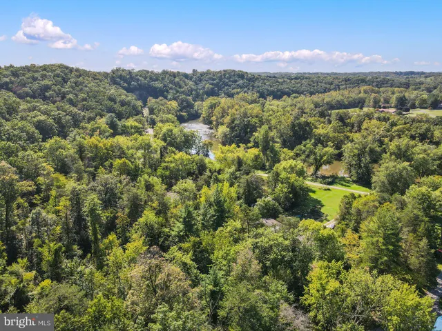a view of a town with mountains in the background