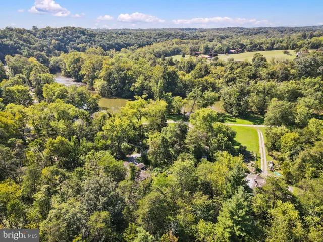 a view of a city with green field