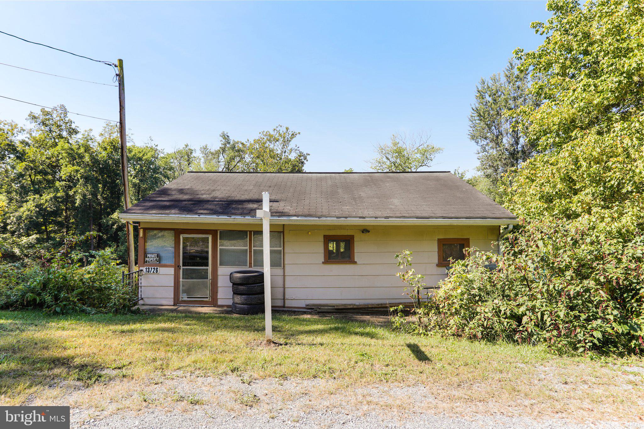 13726 Hopps Landing Road Hagerstown, MD 21740 - Photo 5 of 28 a view of a house with a yard