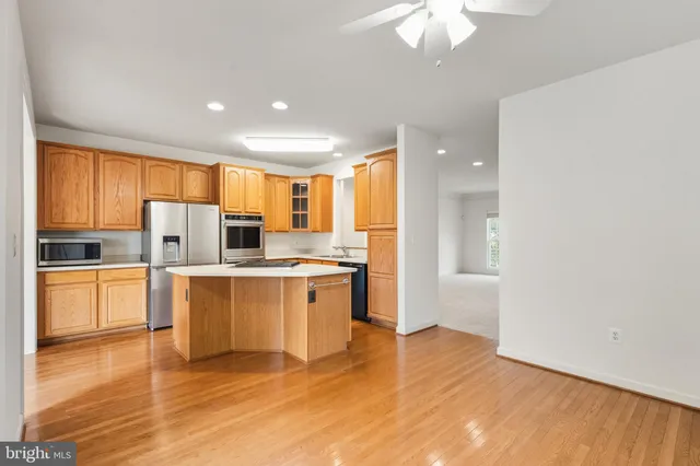 a kitchen with a stove a sink and a refrigerator