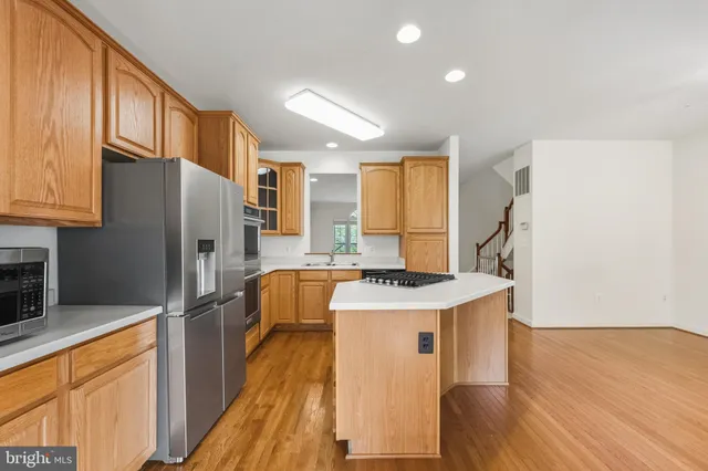 a kitchen that has a sink and a window in it