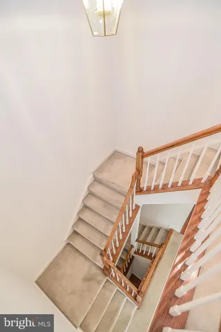 a view of an empty room with a ceiling fan