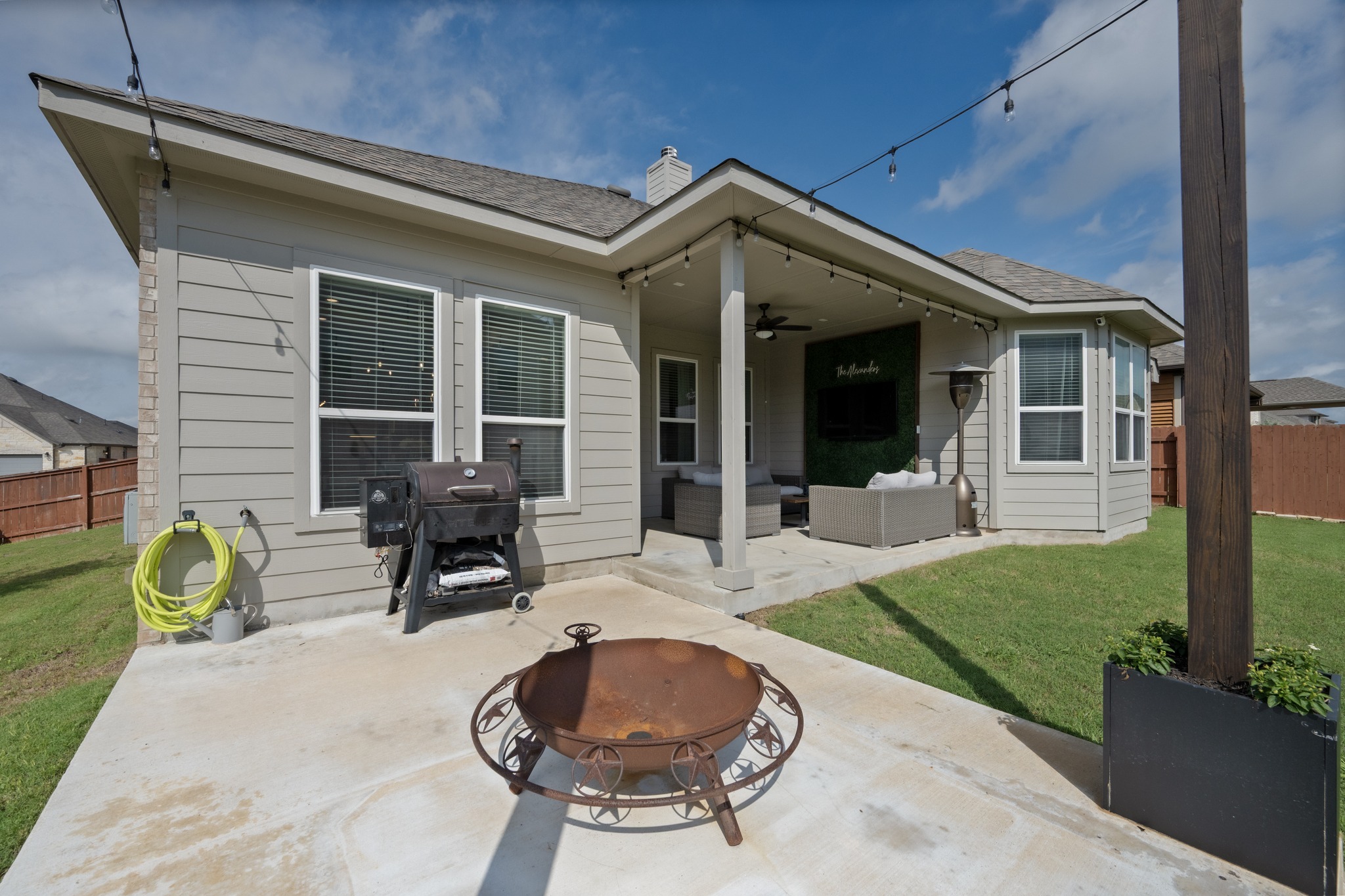 2100 Highland Ridge Road Georgetown, TX 78628 - Photo 27 of 30 A spacious concrete patio and covered porch provide ample space for outdoor living.