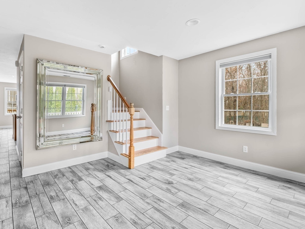20 Angela Rose Lane Worcester, MA 01604 - Photo 12 of 35 a view of an empty room with wooden floor and a window